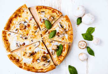 Tasty fresh baked pizza with champignons and chicken fillet