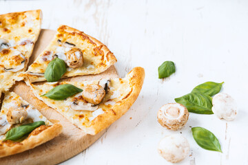 Tasty fresh baked pizza with champignons and chicken fillet