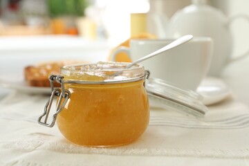 Delicious orange marmalade on table. Space for text