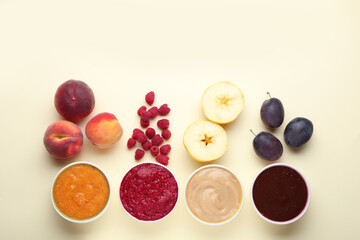 Different puree in bowls and fresh ingredients on beige background, flat lay