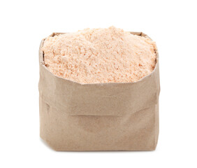 Lentil flour in paper bag isolated on white