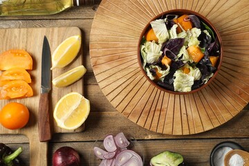 Delicious salad with Chinese cabbage, tomato and basil served on wooden table, flat lay