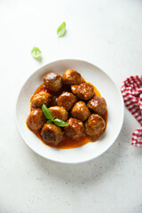 Meatballs with tomato sauce and basil