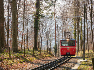Naklejka na ściany i meble Zurich, Switzerland - March 26th 2022 - Red waggon of the Dolder cog railway 