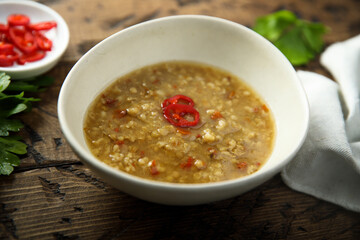 Traditional homemade lentil soup with chili pepper