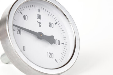 round thermometer, for measuring temperature in water systems, close-up on a white background