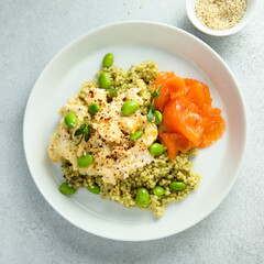 Scrambled eggs with couscous, salmon and beans