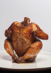 Whole grilled chicken isolated on white background