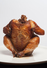 Whole grilled chicken isolated on white background