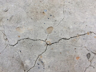 Cracked concrete texture closeup background.