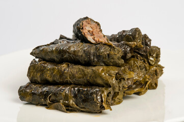 Pile of dolma - stuffed grape leaves with minced meat