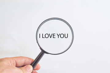 I love you text in magnifying glass. Valentine's day idea concept.