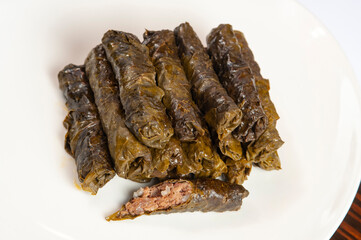Pile of dolma - stuffed grape leaves with minced meat