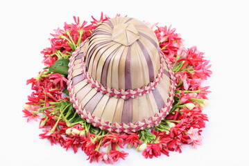 Palm leaf hats  on Combretum indicum 