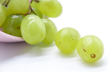 bunch of green grapes on white background