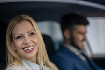 Shot of a cheerful beautiful couple driving in a car together and enjoying in the road trip.