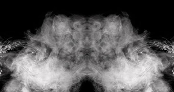 Close-up of mirrored smoke as it billows out of the center of the frame, creating unique shapes as it moves.