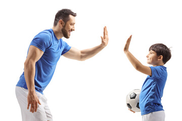 Football player gesturing high five with a boy