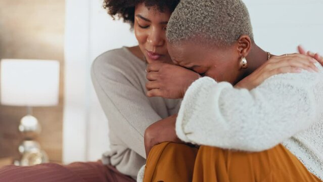 Divorce support, depression crying and friends talking about mental health problem, frustrated with anxiety and sad about love fail in home. African women consoling grief with conversation on sofa