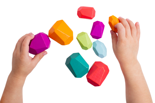 Wooden colorful  toy blocks isolated in kid hands , rainbow color. Baby development. Design element pastel