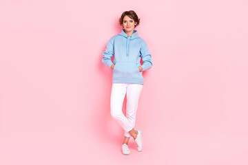 Full length photo of adorable positive lady dressed nice trendy blue clothes posing isolated on pink color background