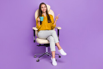 Full size photo of pretty nice person sit chair arm hold coffee cup direct finger empty space...