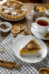 Fresh delicious homemade pumpkin pie served on wooden table
