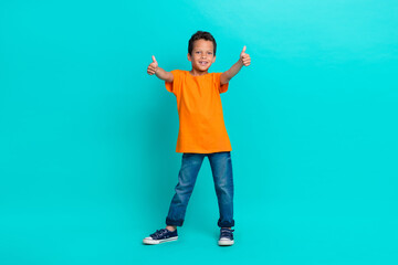 Photo of satisfied boy learner raise two arm show approval yes symbol enjoy nice lesson empty space isolated on cyan color background