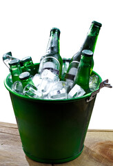 cold bottles of beer in bucket with ice in a restaurant setting