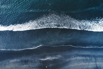 Moody atlantic ocean wave on black sand beach in summer at Iceland © Mumemories