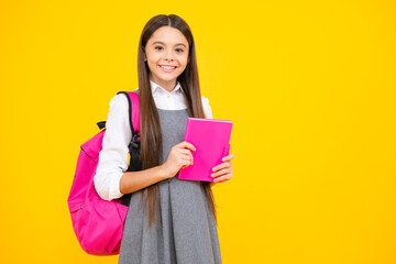 School teenager child girl with book and copybook. Teenager student, isolated background. Learning and knowledge. Go study. Education concept.