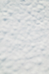 Snow texture. Snow covered land. Winter. Aerial, top view. Drone photo. Background