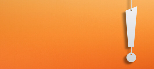 White exclamation mark suspended by rope on orange background