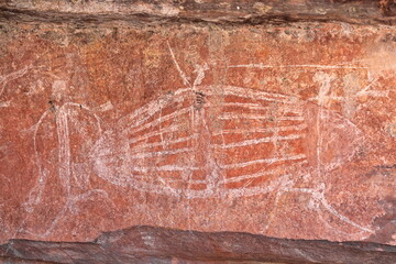 Fototapeta premium Aboriginal rock art: turtle being hunted by locals from a paperbark raft. Ubirr-Kakadu-Australia-193