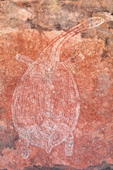 Fototapeta premium Aboriginal rock art: long neck turtle being hunted by locals. Ubirr-Kakadu-Australia-195