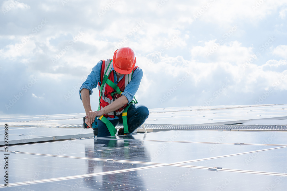 Poster engineer using dril installing solar cell on roof factory,environment friendly,alternative energy to