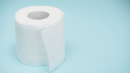 soft and white toilet paper on blue background.