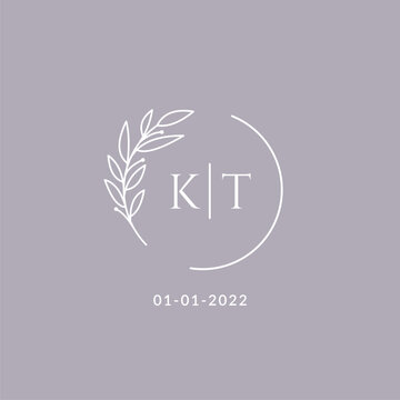 Initial monogram KT wedding logo with decorative floral frame