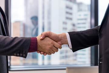 Business people shaking hands. Businessman shaking hands during a meeting in the office	