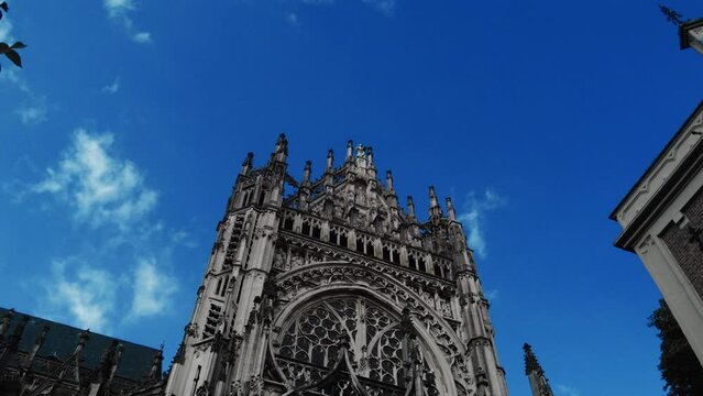 low angle dolly towards tower facade of gothic cathedral in s Hertogenbosch
