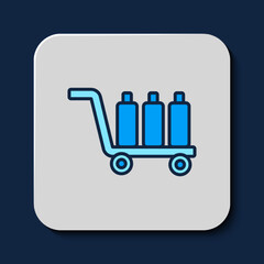 Filled outline Trolley suitcase icon isolated on blue background. Traveling baggage sign. Travel luggage icon. Vector
