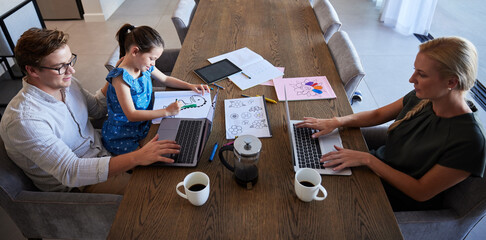 Man, woman and child in home office with laptop, paper documents and kids study homework. Top view of family, mother and father with learning girl working on startup business and children education