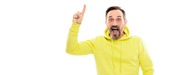 Man face portrait, banner with copy space. mature surprised man pointing finger up. smiling senior guy presenting product isolated on white.