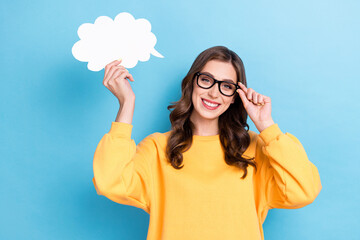 Photo of young positive toothy attractive nice woman wear yellow shirt hold white paper cloud...