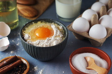 Food ingredients for baking: flour, eggs, milk, sugar