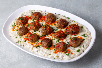 Traditional Turkish food; Meatballs on eggplant puree prepared with yogurt. local name; Alinazik kebab. Turkish name; Kofteli Alinazik kebabi
