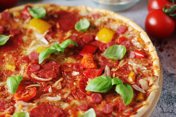 Pizza with salami and basil	