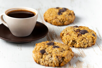 Coffee served with chocolate biscuits
