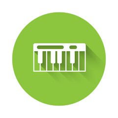 White Music synthesizer icon isolated with long shadow background. Electronic piano. Green circle button. Vector