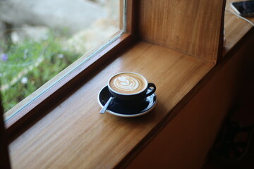 cup of coffee on wooden table